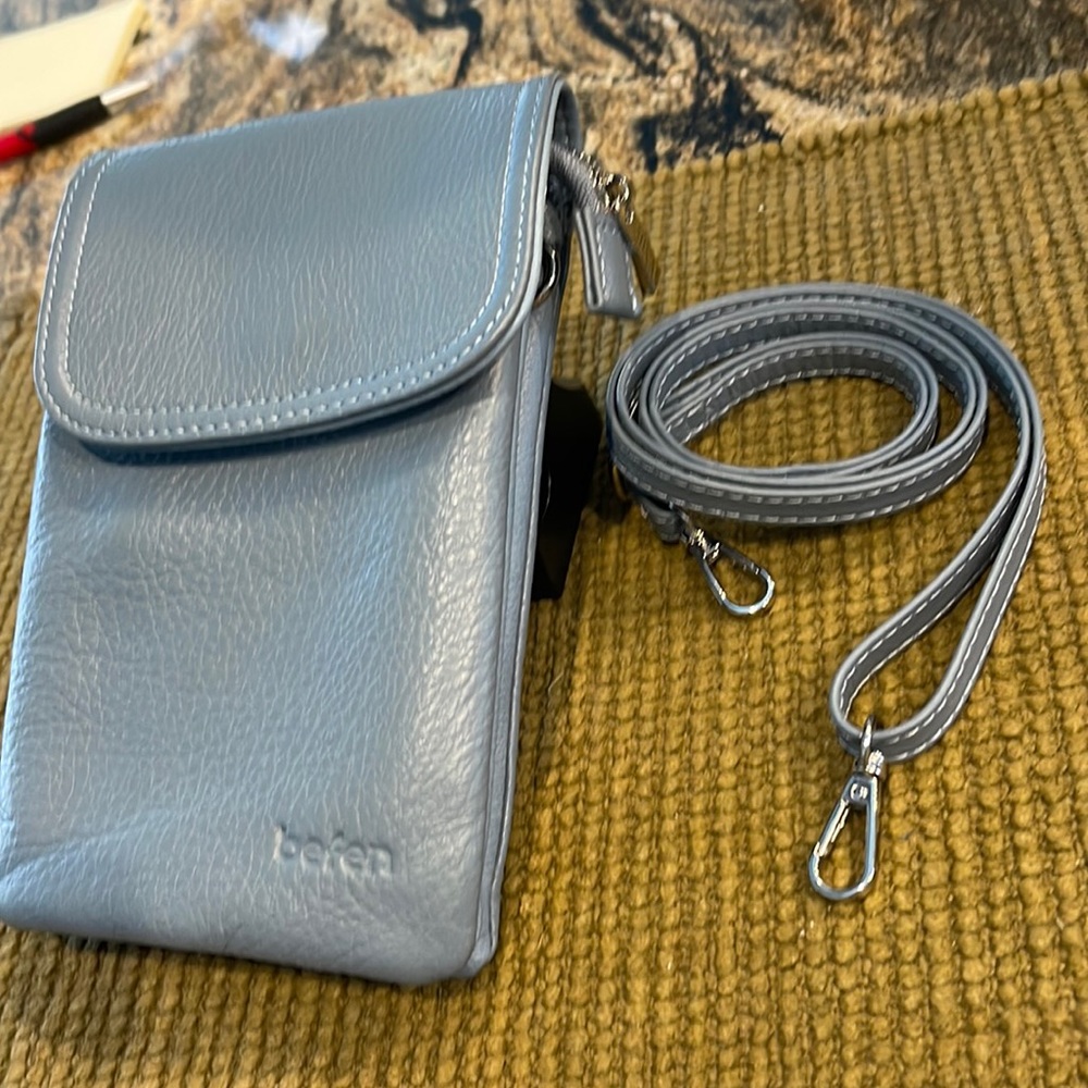 Small leather crossover. Great for store runs.  No need to haul your purse!
